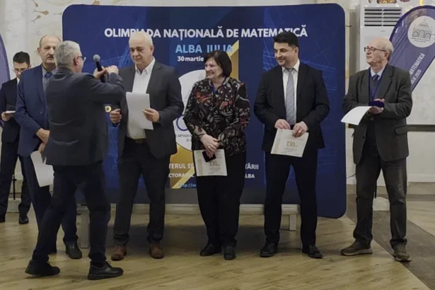 video inspectorul general cornel sandu aur pentru organizarea olimpiadei de matematica alba iulia orasul cu cel mai mare iq din tara timp de cateva zile